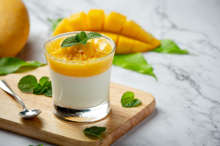 Homemade mango yoghurt on marble backgroud