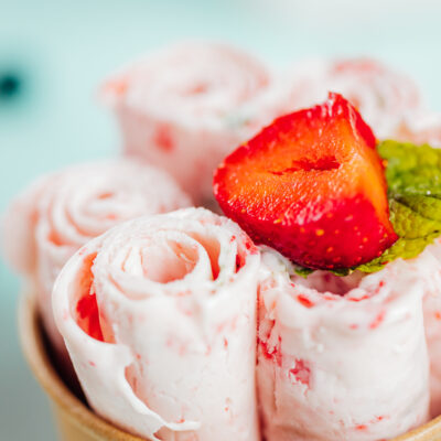 Closeup shot of the strawberry ice cream rolls in the container